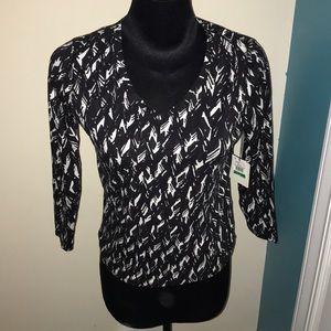 A long sleeve black and white blouse